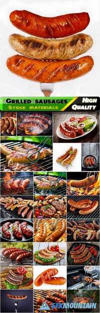 Grilled sausages at the stake with a golden crust Stock images