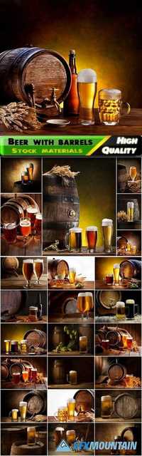 Light and dark beer in mugs and glasses with wooden barrels Stock images