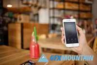 iphone 6 in the cafe-6 photo mockups 442591