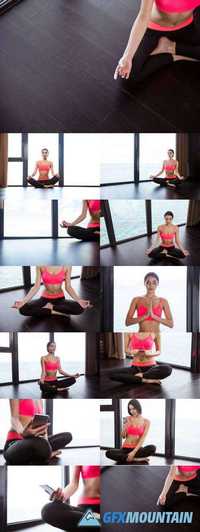 Fitness woman meditating in gym