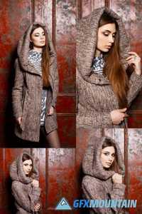 Fashionable Stylish Young Girl in Jacket with Hood Standing Near Red Vintage Wall