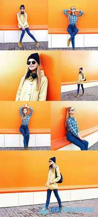 Fashion Pretty Blonde Girl Posing Over Colorful Orange Background