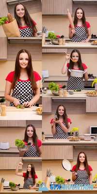 Young Woman Housewife Working in the Kitchen
