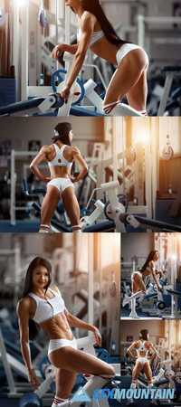 Beautiful Young Woman Posing in the Fitness Gym