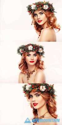 Portrait of Beautiful Young Woman with Christmas Wreath