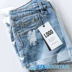 Ripped jean shorts with a tag mockup 