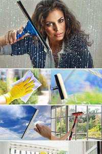 Stock Photo Woman cleaning window glass 
