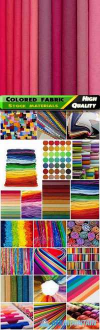 Stacks of colored fabrics and thread and yarn, bed sheets, blankets, scraps of fabric Stock images