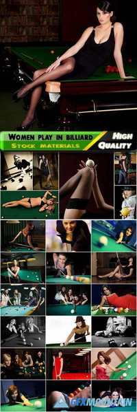 Beautiful and sexy woman and girls play to billiard, cue, billiard balls, a table covered with green velvet cloth Stock images