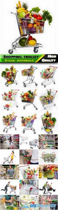 Shopping trolley with vegetabels and other food products in supermarket Stock images
