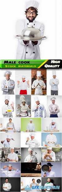 Male cook in the kitchen in a white apron Stock images