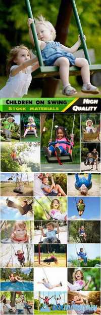 Happy children and kids on a swing have a fun Stock images