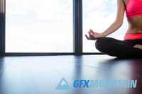 Fitness woman meditating in gym