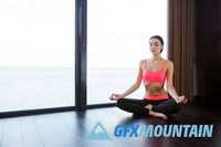 Fitness woman meditating in gym