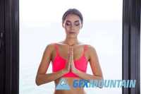 Fitness woman meditating in gym