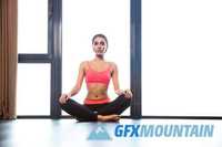 Fitness woman meditating in gym