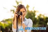 Hipster woman with retro film camera