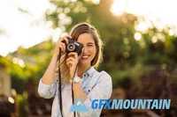 Hipster woman with retro film camera