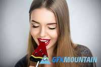 Woman sucking lollipop