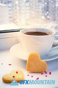 Two sponge heart and a cup of hot coffee