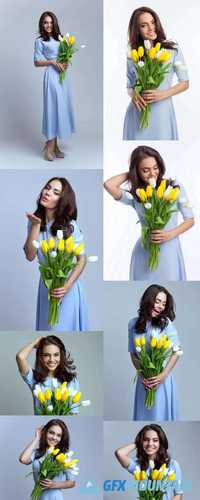 Beautiful Girl in the Blue Dress with Flowers Tulips in Hands